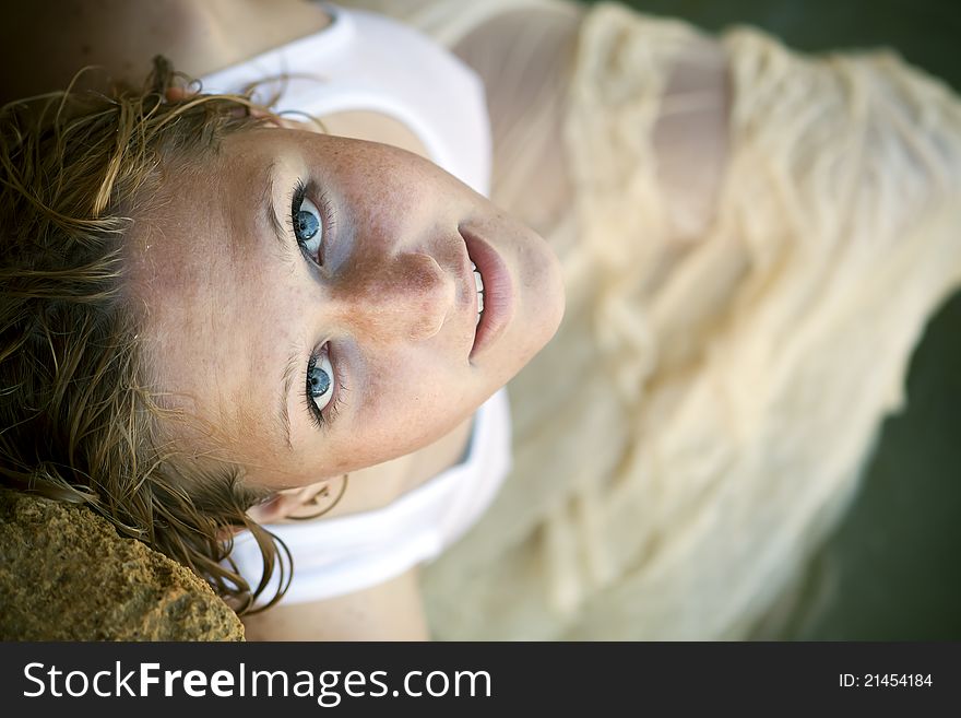 Portrait of a girl with red hair and freckles