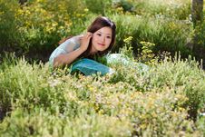 Young Beautiful Girl Laying On The Flowers Field Royalty Free Stock Photography Young Beautiful Girl Laying On The Flowers Field Royalty Free Stock Photography