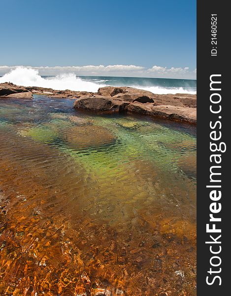 The view of a rock pool next to the ocean, Robberg, South Africa
