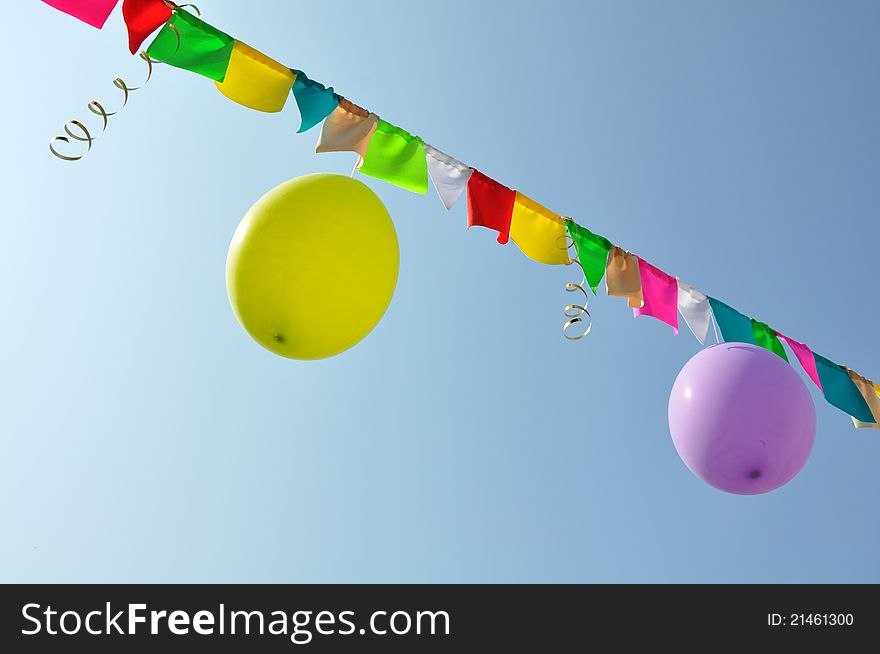 Holiday streams, flags, and balloons on the string