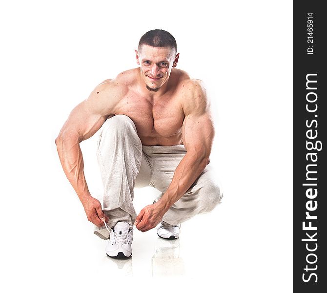 Strong athletic man isolated over white background