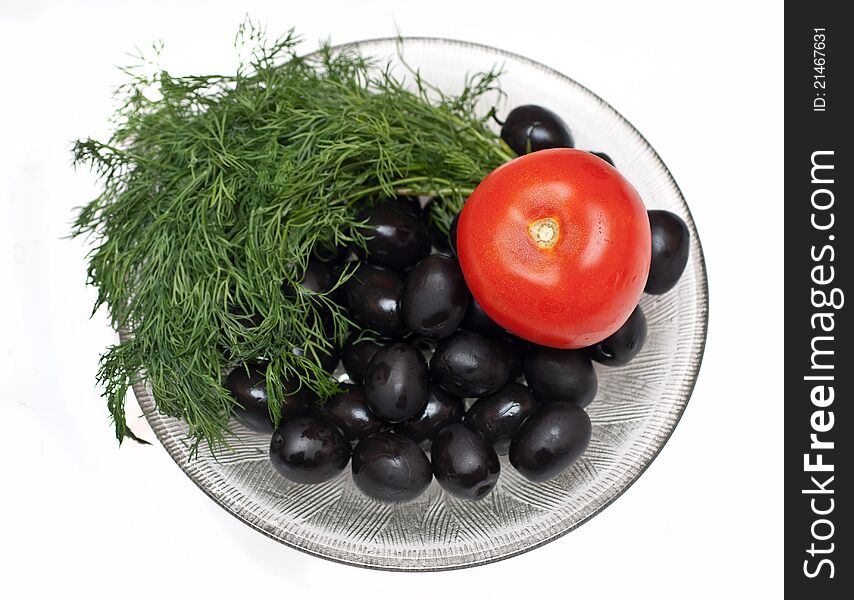 Plate of olives,sheaf of green dill and tomato isolated over white background. Plate of olives,sheaf of green dill and tomato isolated over white background.