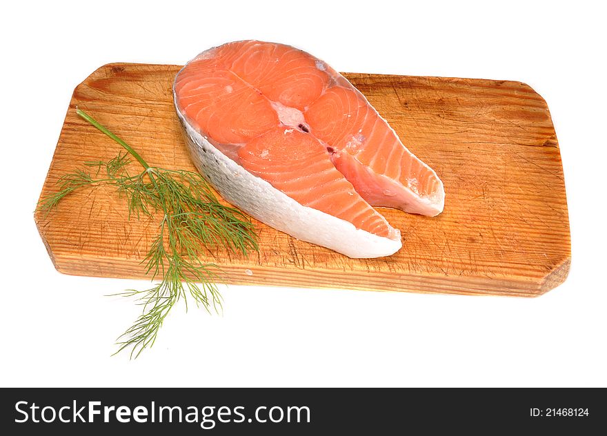 Piece of a crude salmon on a board