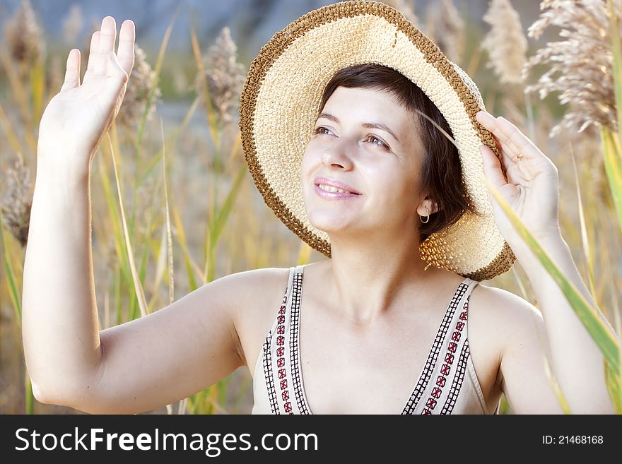 Portrait of beautiful brunette woman in summer