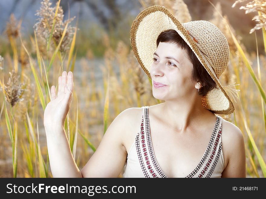 Portrait of beautiful brunette woman in summer