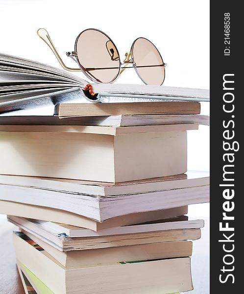 Composition with stack of books on table