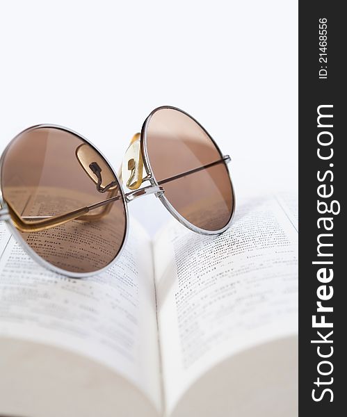 Close up photo of spectacles on a book