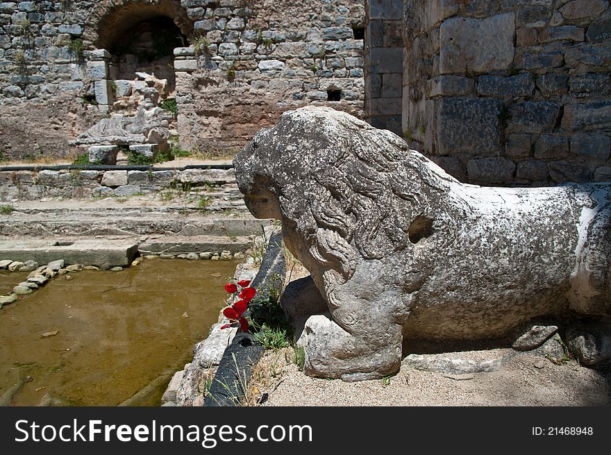 The frigidarium (cold room) in the baths of Annia Faustina (ancient Greek city of Miletus - today on the territory of Turkey), with a lion stone fountain sculpture in the foreground and the statue of the river god Meander in the background. The frigidarium (cold room) in the baths of Annia Faustina (ancient Greek city of Miletus - today on the territory of Turkey), with a lion stone fountain sculpture in the foreground and the statue of the river god Meander in the background.