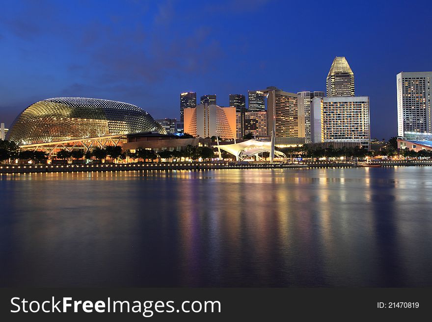 Esplanade Theater with modern building at dusk, Singapore
