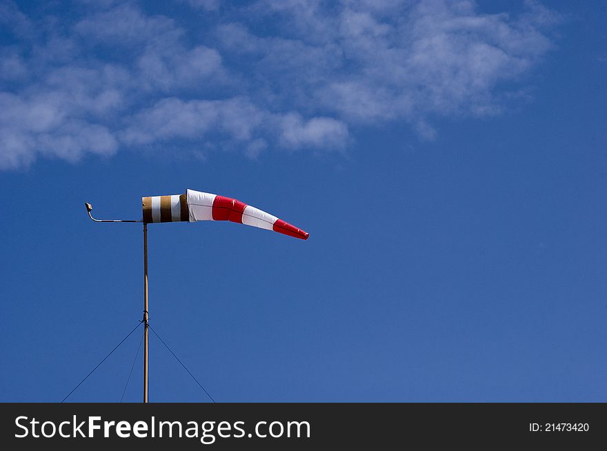 An windsock at airfield showing wind direction. An windsock at airfield showing wind direction.