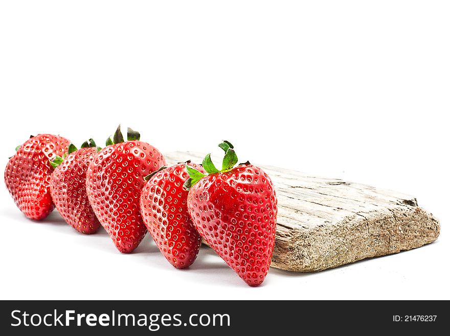 Group of strawberries over a piece of old wood. Group of strawberries over a piece of old wood