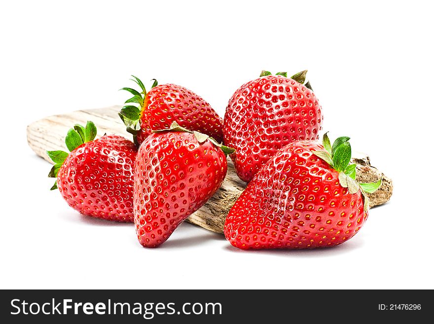 Group of strawberries over a piece of old wood. Group of strawberries over a piece of old wood