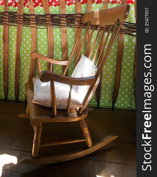 Old wooden chair on terrace.