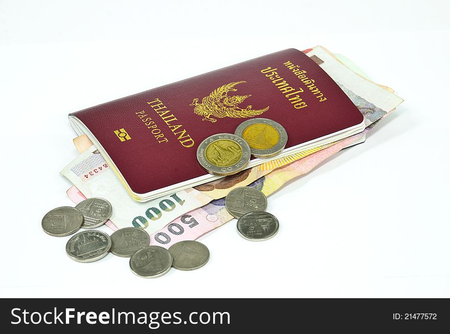 Thailand passport and Thai money on white background