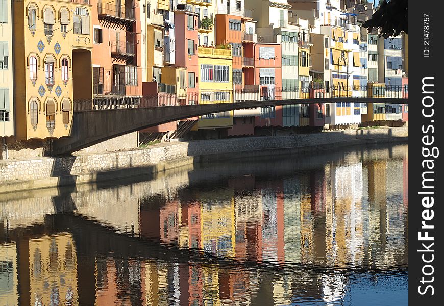 Reflections of buildings and bridge in Girona, Spain. Reflections of buildings and bridge in Girona, Spain.