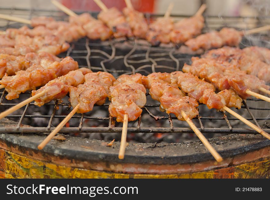 Grilled pork on hot oven at Thai market. Grilled pork on hot oven at Thai market