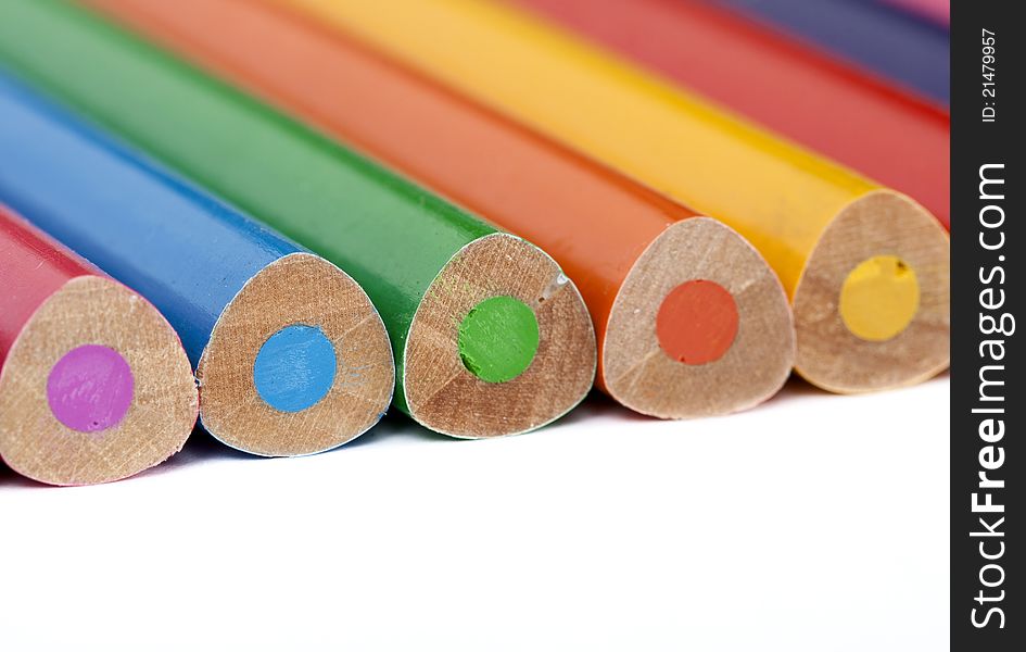 Crayons lined up on white background