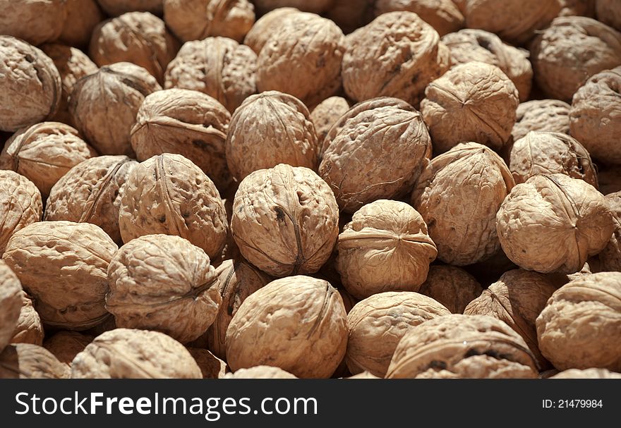 Bunch of ripe brown walnuts