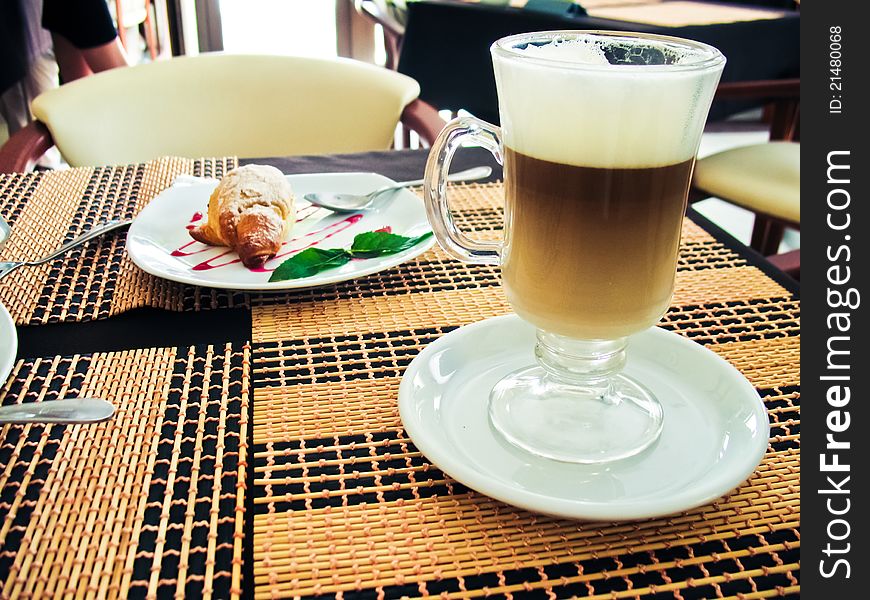 Breakfast with latte macchiato and croissants