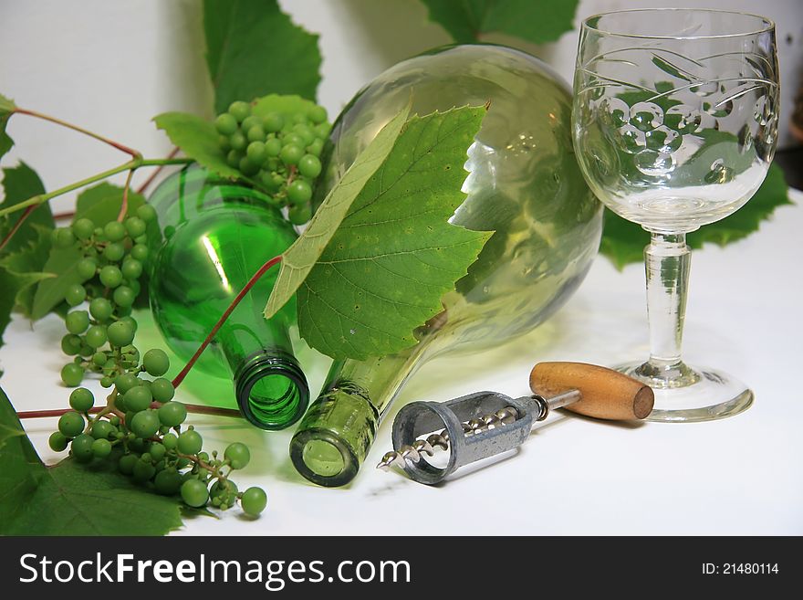 Grapes, a bottle and a glass of wine.