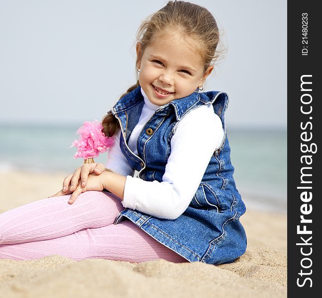 Portrait of cute young girl on the beach