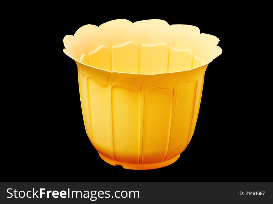 Yellow ornamental flowerpot isolated on Plastic background. Yellow ornamental flowerpot isolated on Plastic background