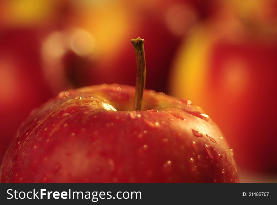 Big red apple with early dew