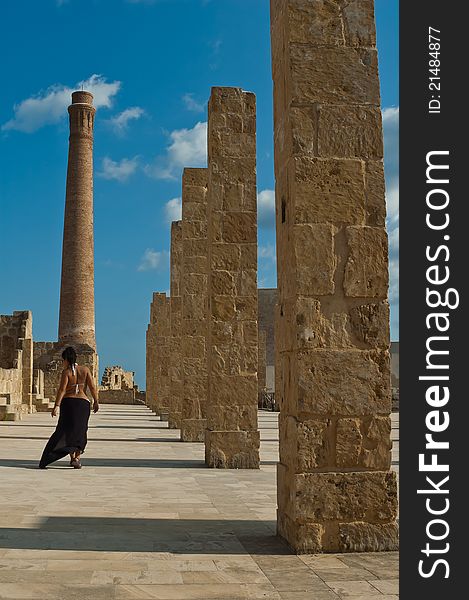 Walking woman on tuna ruins in vendicari natural oasis during sunset. Walking woman on tuna ruins in vendicari natural oasis during sunset