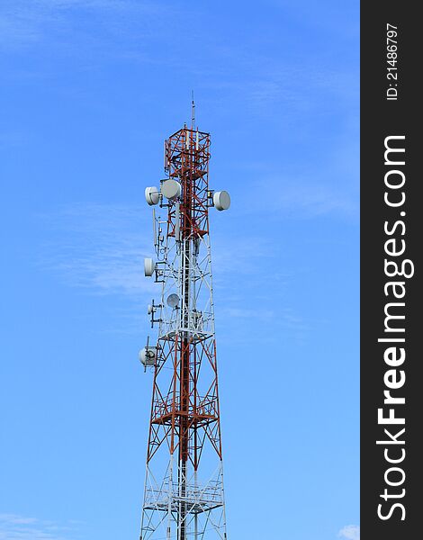 Telecommunication tower with blue sky background.