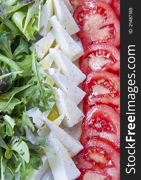 Tricolor salad dish made with cheese and tomatoes. Tricolor salad dish made with cheese and tomatoes