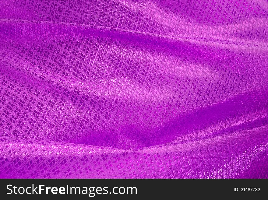 Wave of purple textile for background