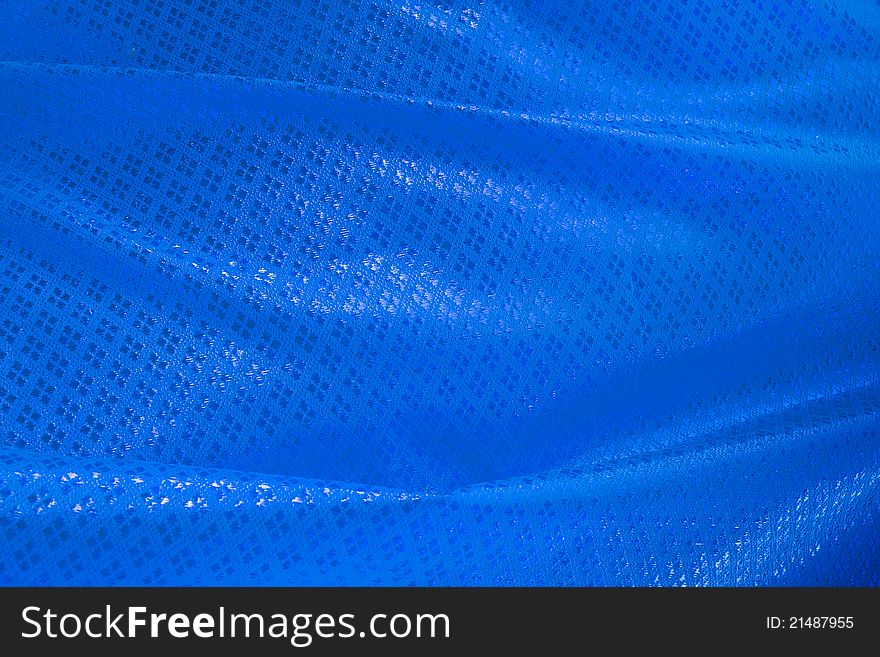 Wave of blue textile for background