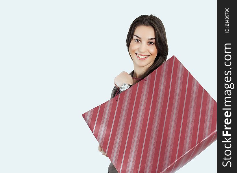 Portrait of lovely young woman with shopping bag