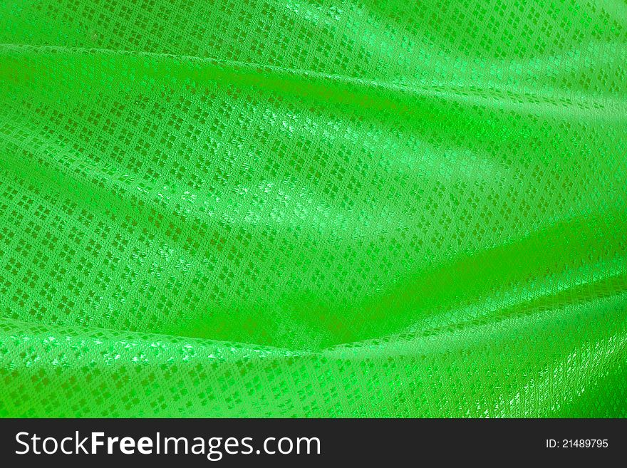 Wave of green textile for background