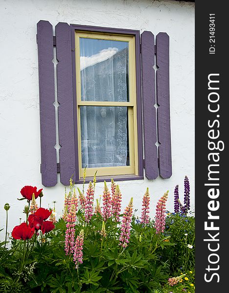 Little White Cabin With Flowers