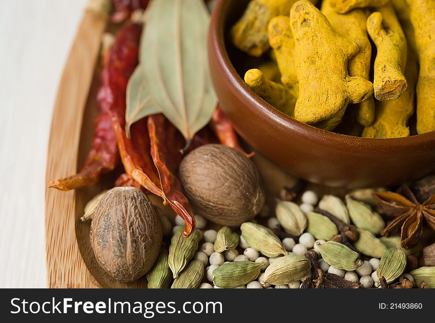 Set of colorful fragrant spices spices on wooden tray