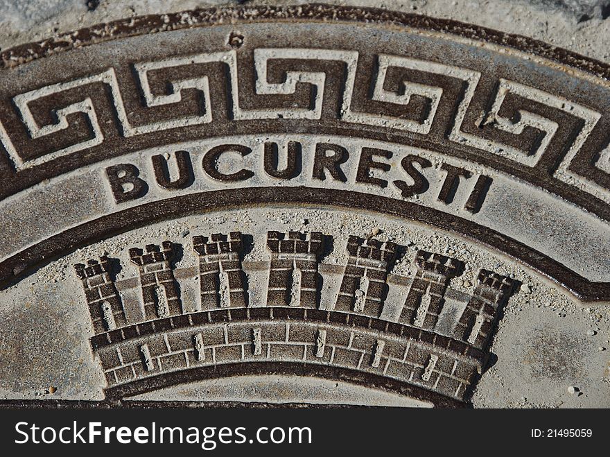 Lipscani, central and historical area of Bucharest, close up picture over a manhole cover with the symbol of Bucharest. Lipscani, central and historical area of Bucharest, close up picture over a manhole cover with the symbol of Bucharest