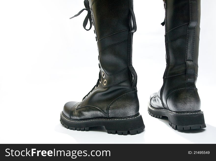 The high black boots on a white background