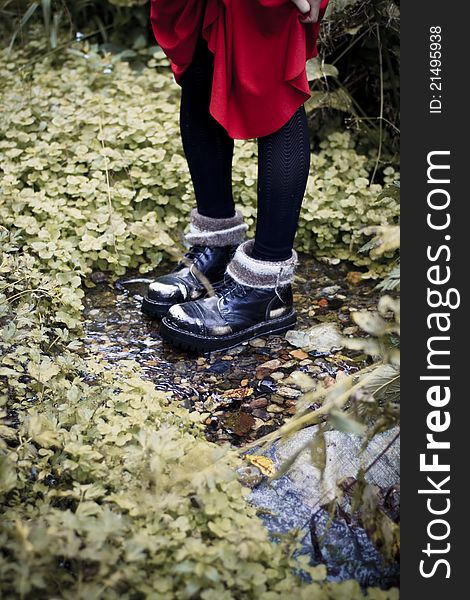 Young woman travels in her boots. Young woman travels in her boots.