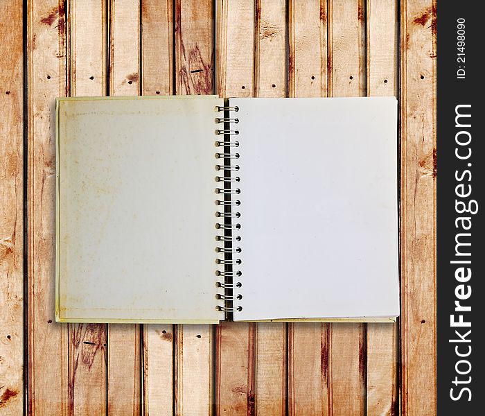 Old notebook on wood panels for background