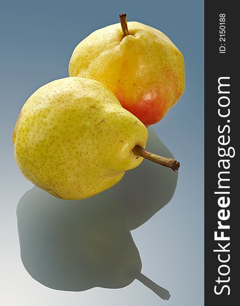 Two ripe Chinese pears on a glass table with reflection. Two ripe Chinese pears on a glass table with reflection