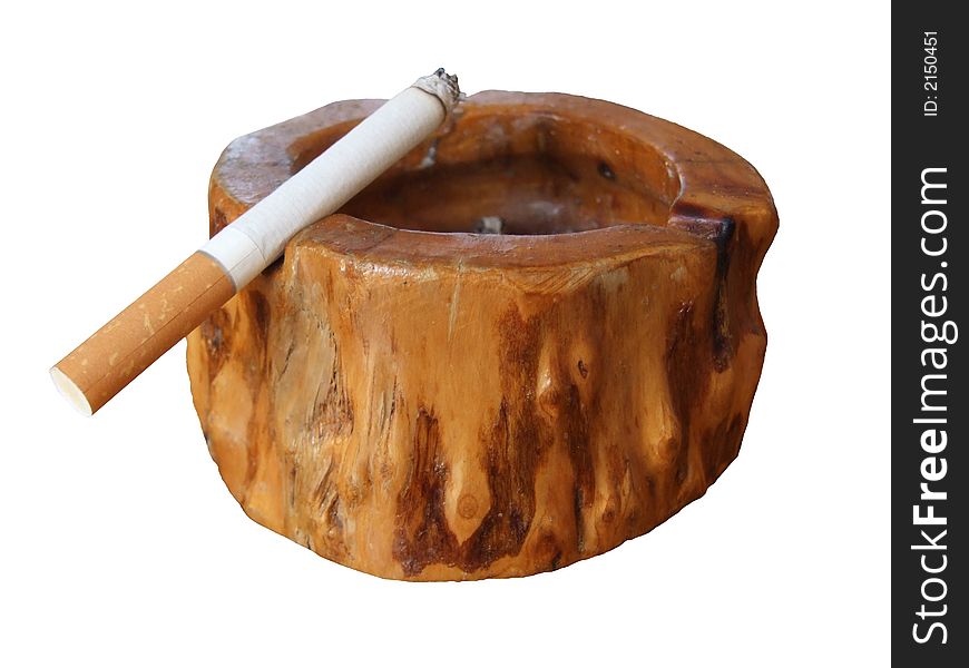 Cigarette in wooden ashtray with white backround