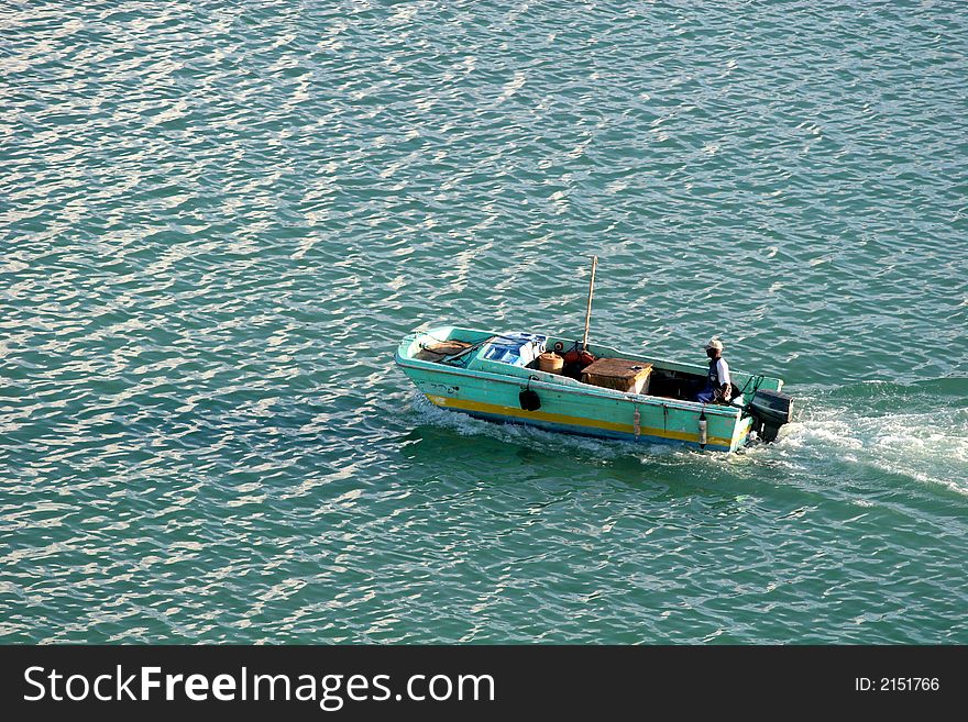 Island fisherman cruising across the bay. Island fisherman cruising across the bay