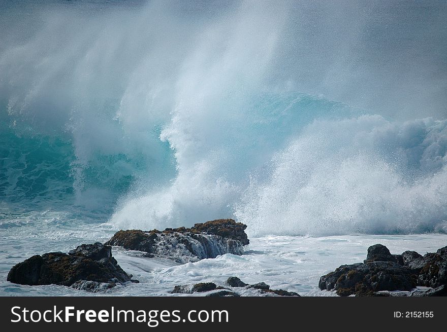 Large winter wave crashing at Kaena Point on the Island of Oahu