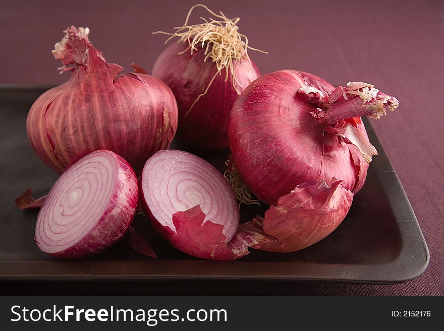 Arrangement of Red Onions some cut in half