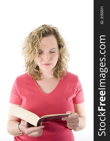 Attractive blonde reading a book isolated on white