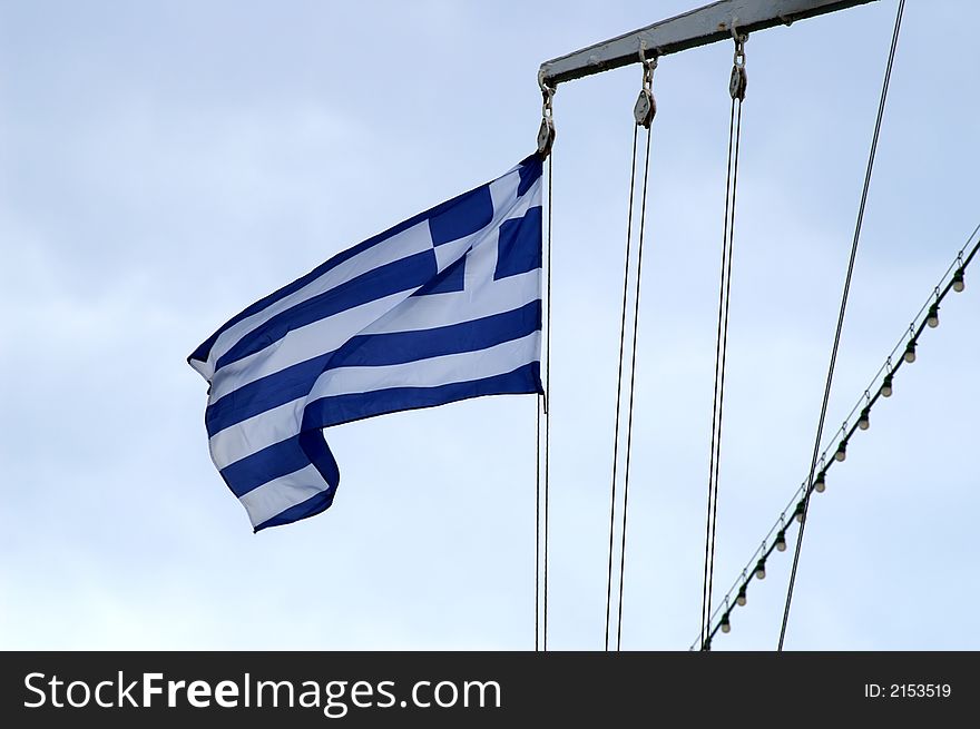 Greece flag on a cruise ship in Mediterranean sea