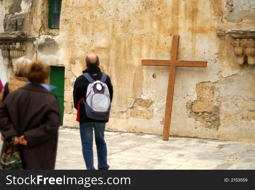 Pilgrim with a cross in  jerusalem on the last christ road