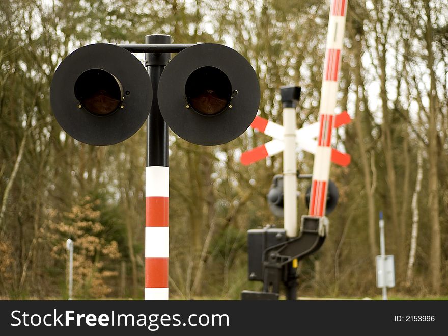 Railway-crossing attended with red lights