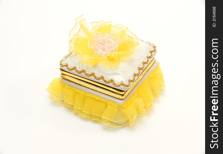 Yellow casket for storage of ornaments and jewelry